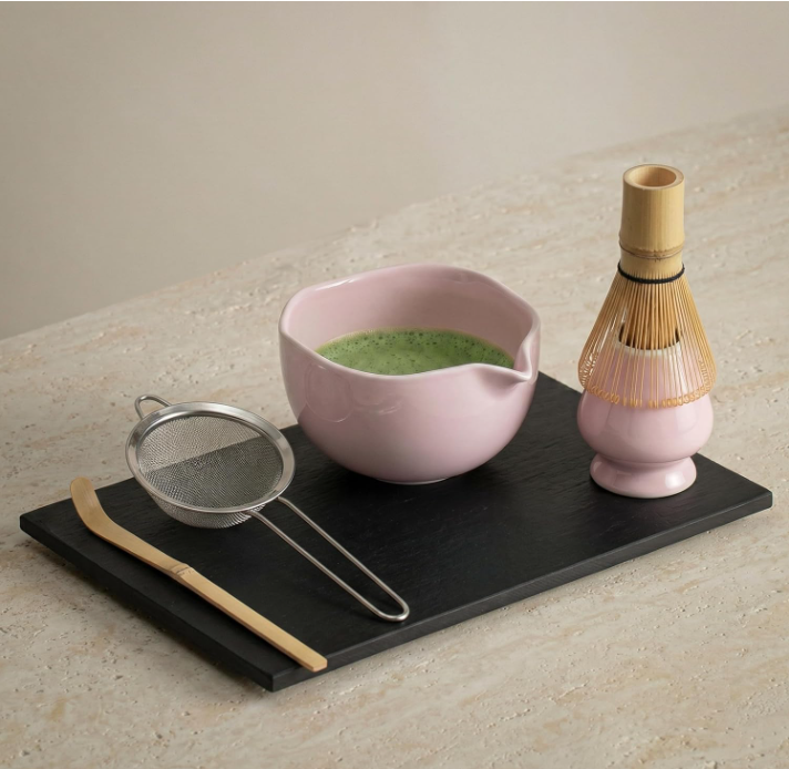 LiveWell Rituals Pink Matcha Kit ceramic bowl and bamboo whisk with prepared matcha on a slate serving board